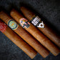 Three cigars with visible labels on a dark textured background